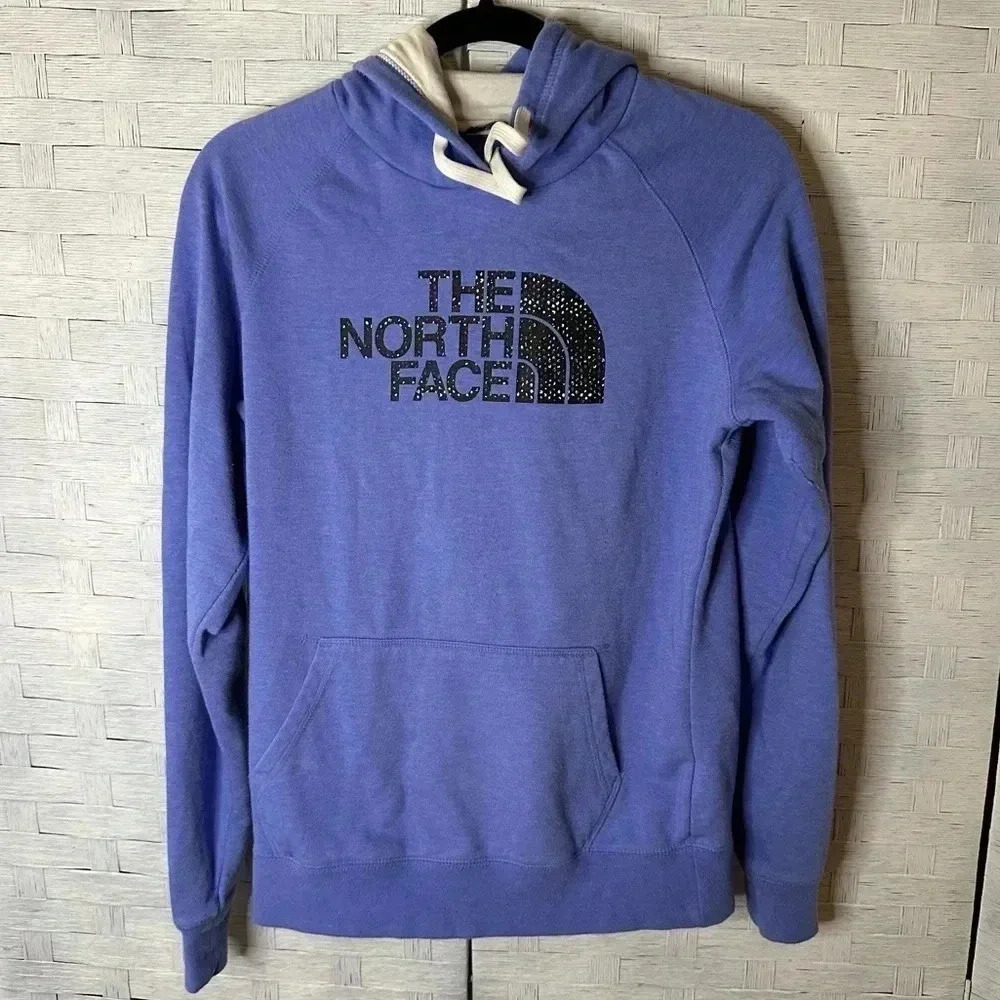 The North Face hoodie. Blue/black emblem with multicolored speckles casual